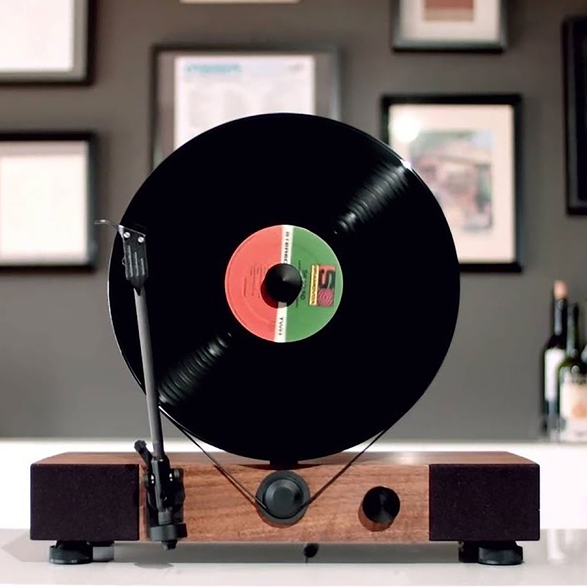 Floating Record vertical Bluetooth turntable with built-in stereo speakers.