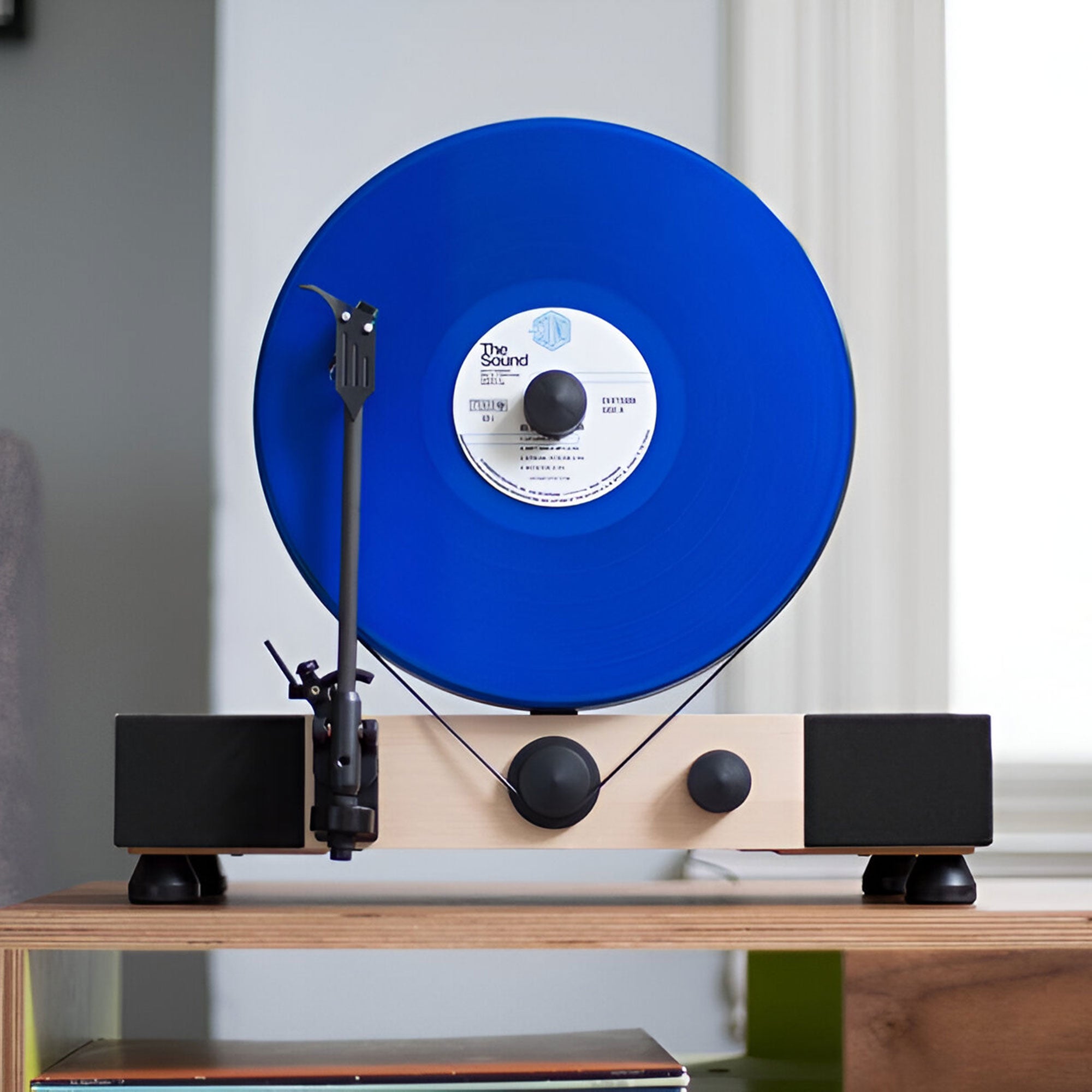 Floating Record vertical Bluetooth turntable with built-in stereo speakers.